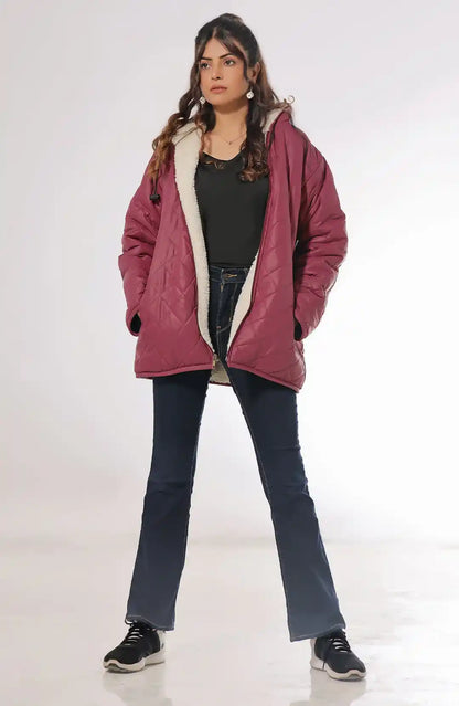 Burgundy quilted hooded jacket with sherpa lining, zip front and pockets.