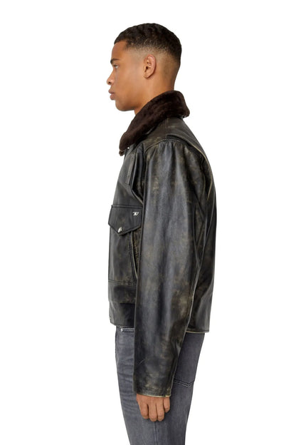 Diesel black leather jacket side view with faux-fur collar and snap chest pocket