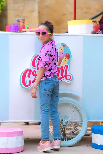 Dhaga kids purple swirl-print T-shirt with blue denim jeans, side view