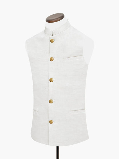 Beige sleeveless waistcoat with stand collar, chest pocket, and gold button front