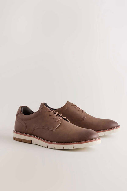 Tan brown lace-up oxford shoes with brown laces and white rubber sole