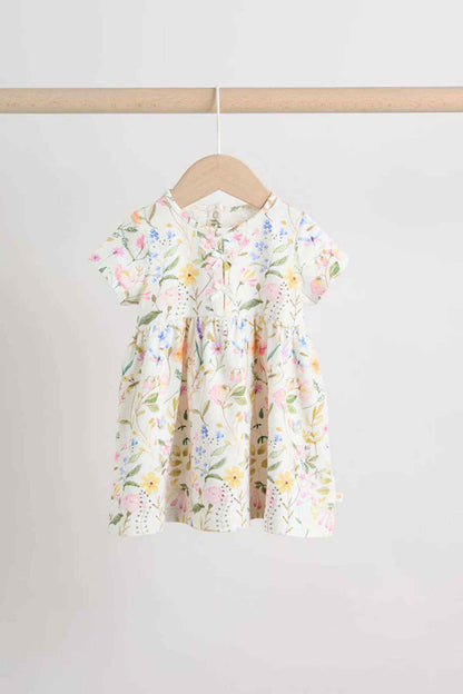Cream floral kids dress with short puff sleeves and gathered waist