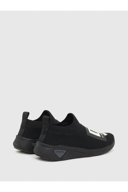 Black Diesel slip-on sneakers, side view with white logo and cushioned heel tab