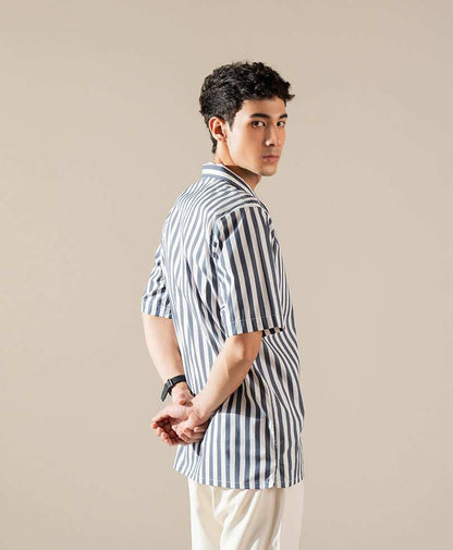 Fitted blue-and-white vertical striped short-sleeve button-up shirt, side profile