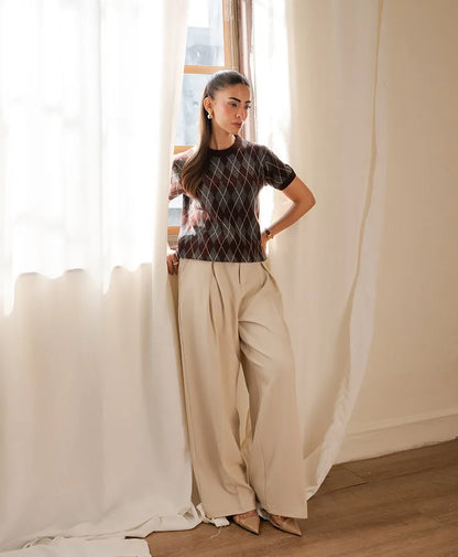 Fitted argyle knit top with short sleeves, dark argyle pattern and crew neck