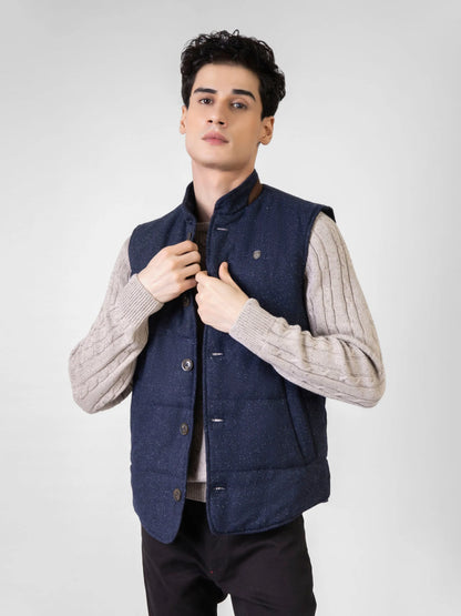 Navy padded sleeveless vest with button-front and stand collar