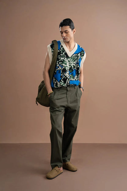 Blue V-neck sleeveless patterned sweater vest with white rib trim