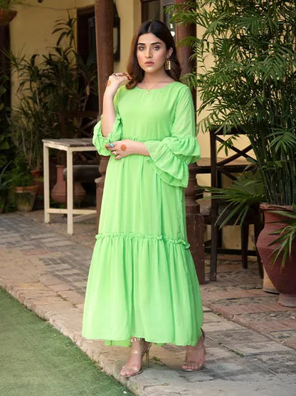 Green tiered midi dress with gathered bodice and ruffle-trimmed hemline