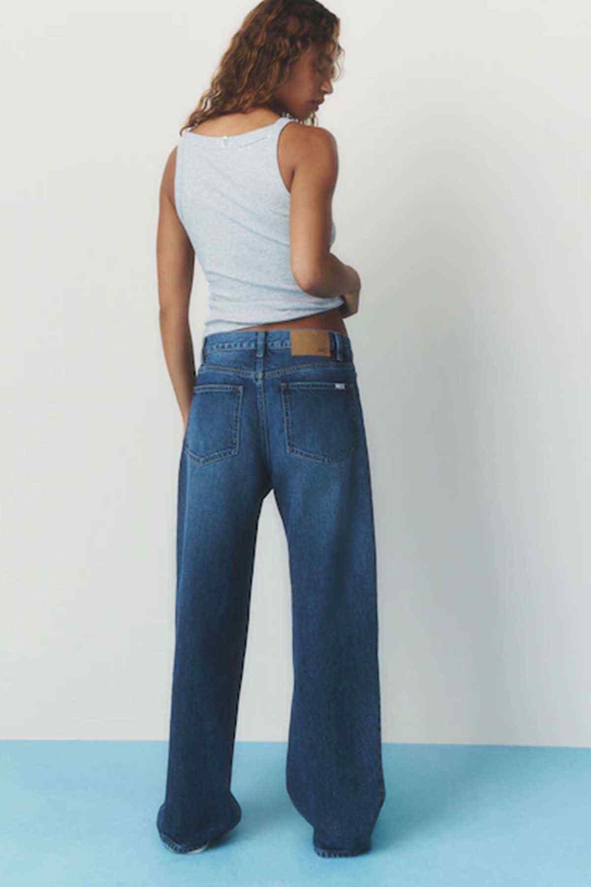 Women's dark blue denim jeans, wide-leg cut with rear pockets and belt loops