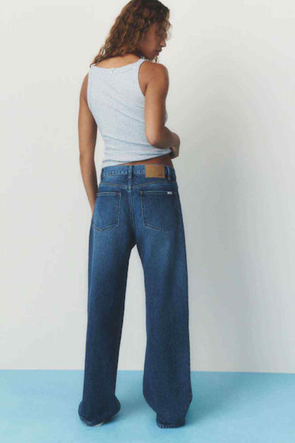 Women's dark blue denim jeans, wide-leg cut with rear pockets and belt loops