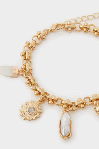 Accessorize gold charm bracelet with sunburst and oval drop charms, link chain