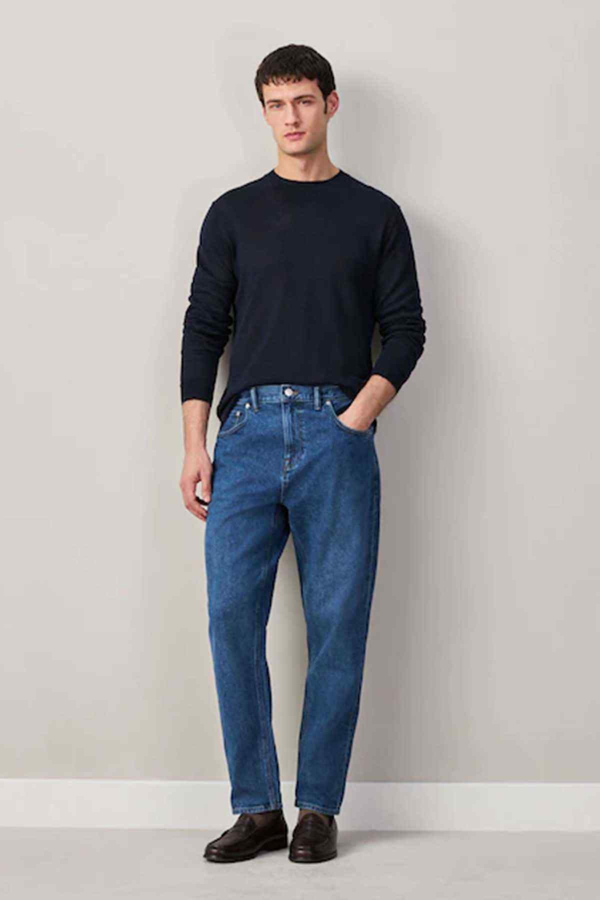 Men's mid-blue denim jeans with straight legs and five-pocket design