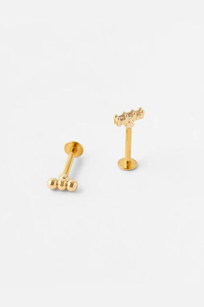 Gold tone stud earrings with vertical post and ball charm detail
