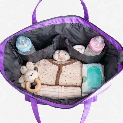 Open purple tote bag interior with soft toys and bottles in main compartment