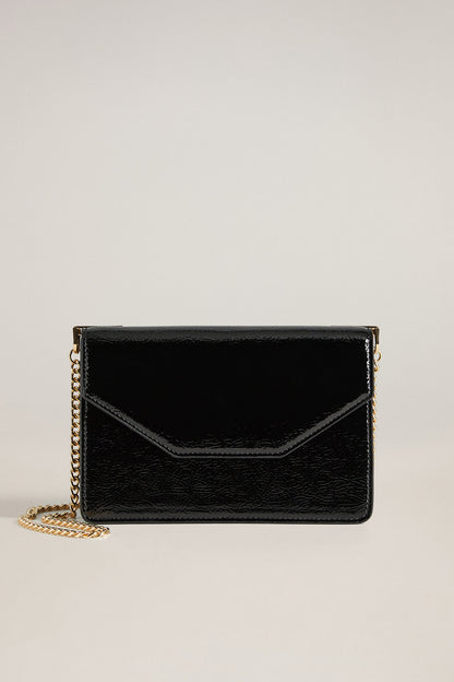 Black leather crossbody bag with gold chain and flap front