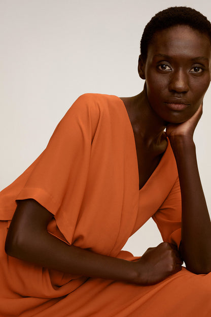 Orange V-neck dress with gathered waist and flowing short sleeves