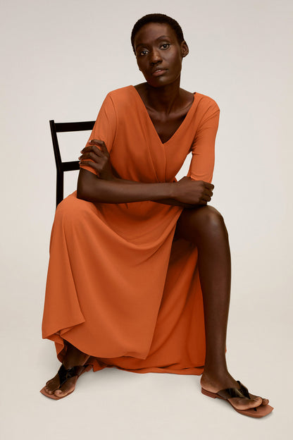 Orange V-neck wrap-style dress with short sleeves and tied waist