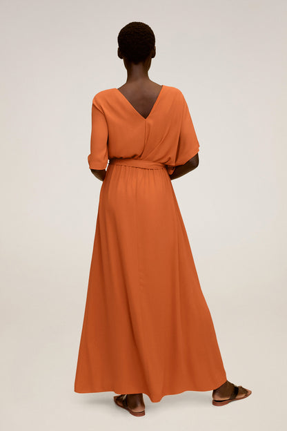 Orange V-neck maxi dress, short sleeves, belted waist with draped skirt