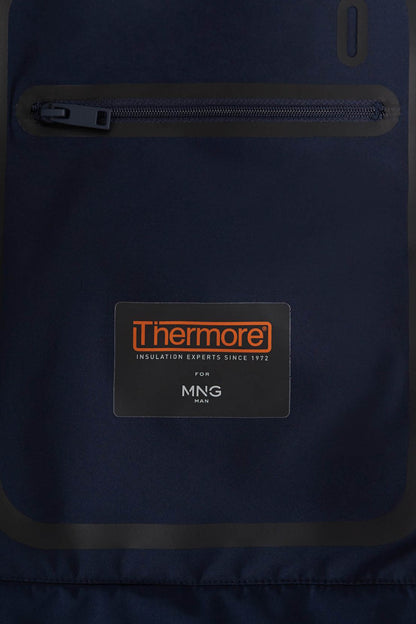 Dark blue hooded jacket panel with Thermore logo and visible zipper