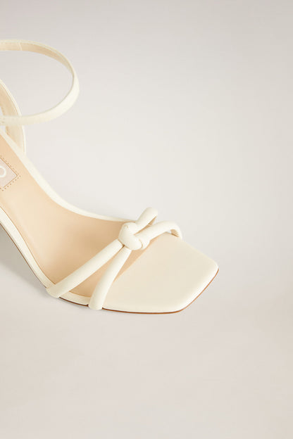 Ice grey heeled sandal with bow ankle strap and open toe, side view