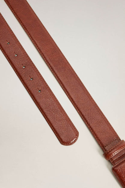 Brown leather belt straps with punched adjustment holes and stitching