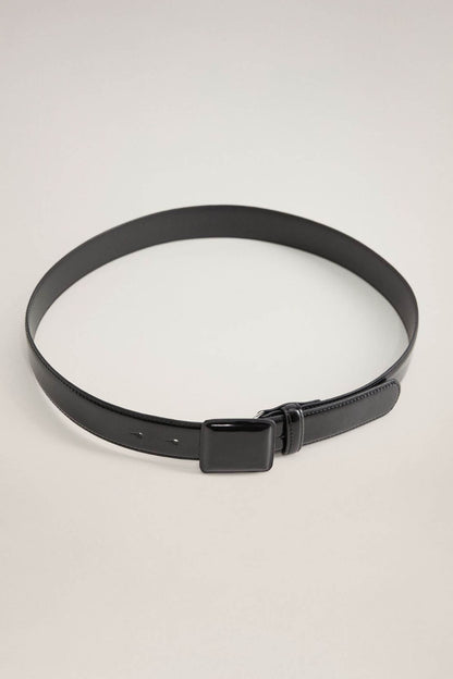 Black belt with simple square buckle and smooth strap with punched adjustment holes.