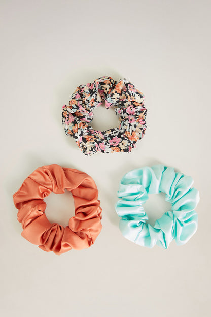 Mango scrunchie set: floral, coral orange, and aqua ruffle hair ties