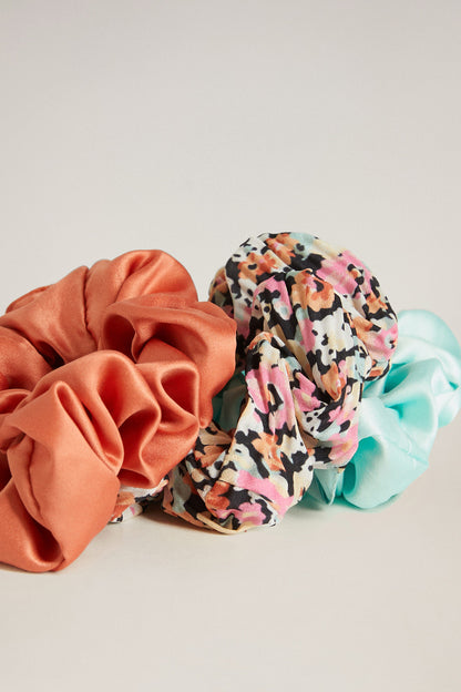 Mango scrunchie set in coral and floral print with hints of aqua ruffles