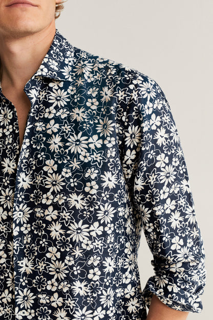 Floral button-up shirt close-up, dark blue with white daisy print