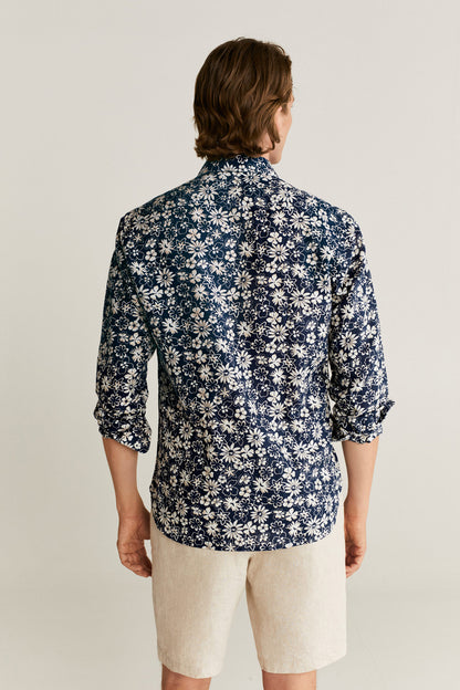 Floral button-up shirt, dark blue with white flower pattern, back view