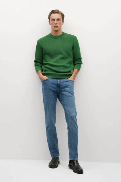 Green knit crewneck sweater with ribbed cuffs, front view