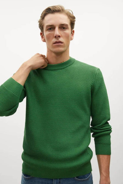 Green knit crewneck sweater with ribbed collar and cuffs