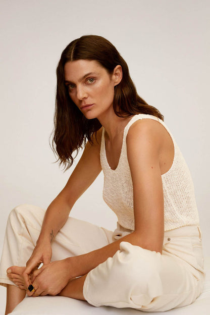 MANGO ecru textured sleeveless knit tank with high-rise trousers, side view