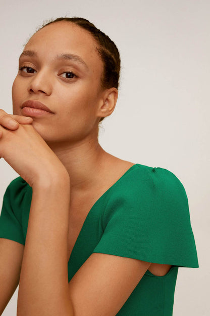 Green V-neck short-sleeve top with puff sleeve detail