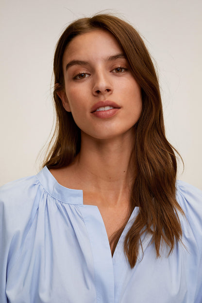 Sky blue V-neck shirt dress with gathered yoke detail and puff sleeves