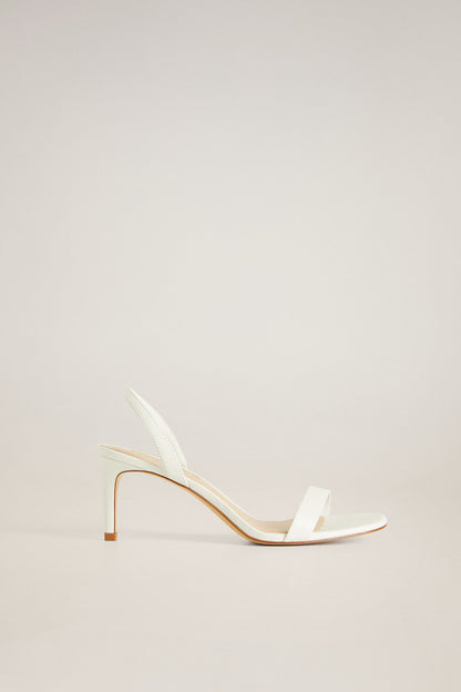 Off-white heeled sandal with ankle strap, open toe, thin stiletto heel.