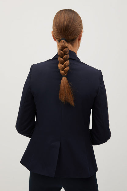 Women's dark navy blazer back view with fitted shoulders and long sleeves