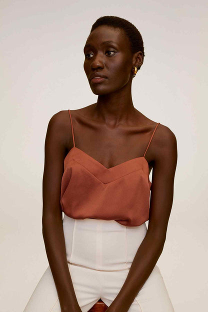 Burnt orange camisole top with V-neck and thin spaghetti straps