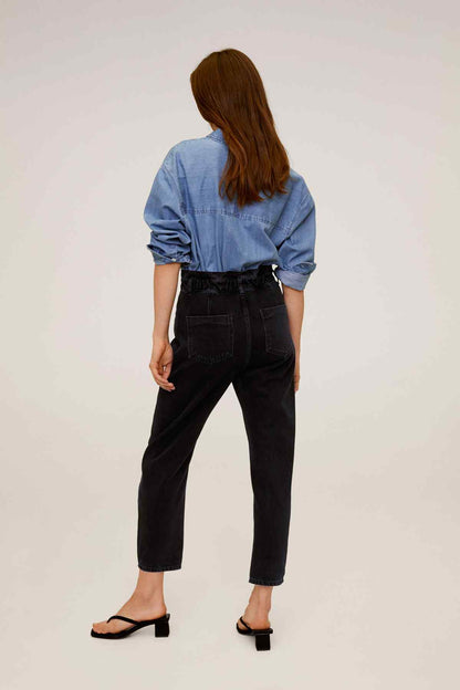 Black denim jeans, back view with belt loops and button waist closure