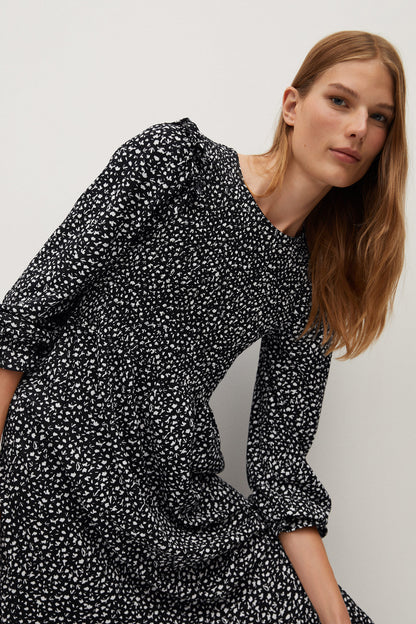 Black printed long-sleeve dress with gathered shoulders and ruched cuff