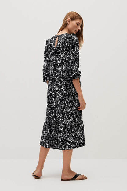 Black printed midi dress, three-quarter view, long sleeves and ruffle hem detail