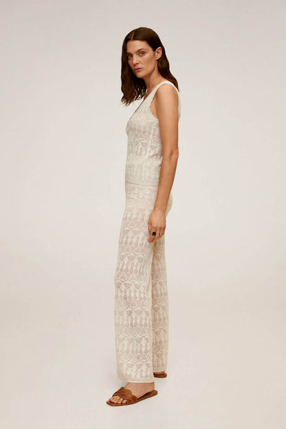 Light grey sleeveless lace-pattern top and wide-leg pants set, standing side view