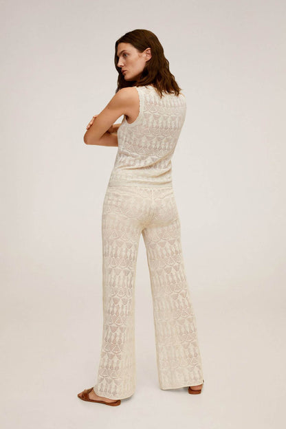 Light grey sleeveless lace-pattern top and wide-leg pants set, side view