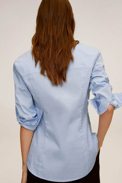 Sky blue button-up shirt back view with long sleeves and curved hem
