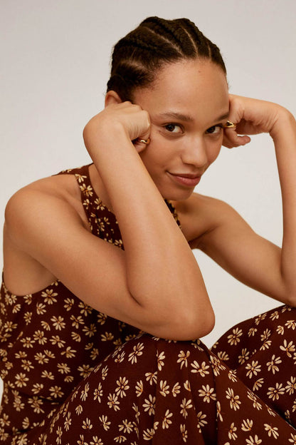 Brown floral sleeveless V-neck dress with gathered waist and tie detail