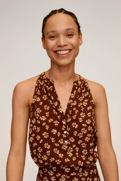 Brown floral sleeveless wrap dress with V-neck front and gathered waist