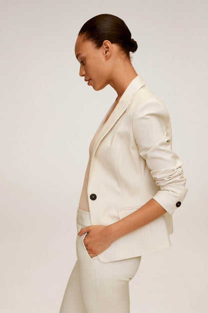 Beige single-breasted blazer with flap pockets and button cuffs