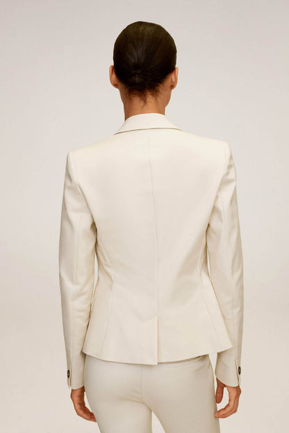 Beige blazer back view with tailored seams and buttoned cuffs