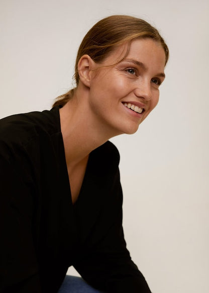 Black V-neck long-sleeve blouse with smooth neckline and loose drape