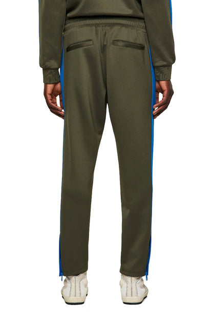 Diesel green track pants with blue side stripe, back pockets, tapered legs